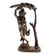 Brass Goddess Statue Under A Tree