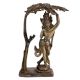 Brass Goddess Statue Under A Tree