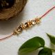 Traditional Rakhi with Kundan Beads, Acrylic, Metal, Wooden